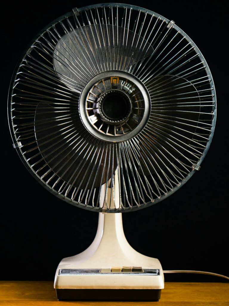 White desk fan on a home office desk