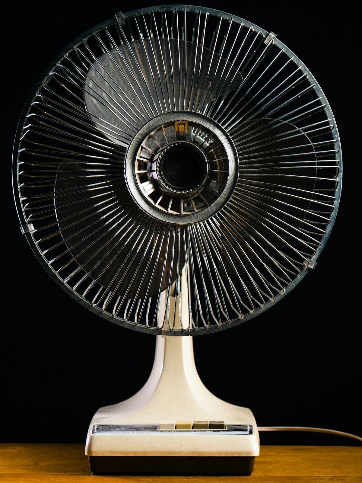 White desk fan on a home office desk