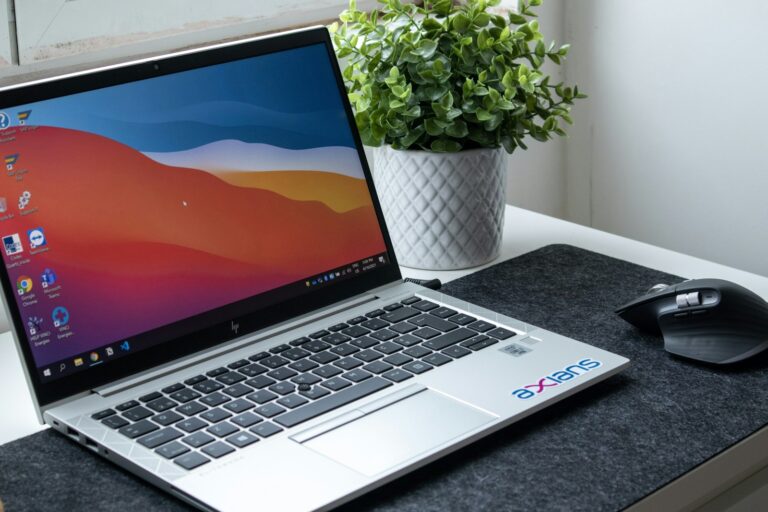 Laptop set up on a home office desk for remote work