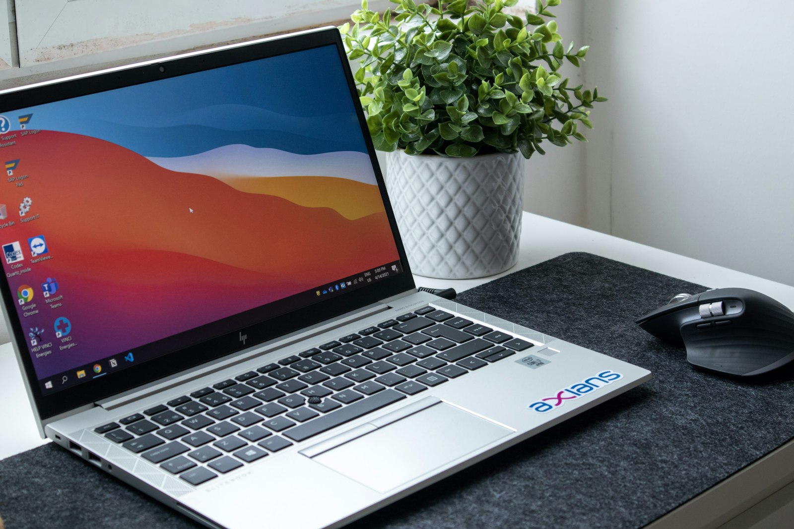 Laptop set up on a home office desk for remote work