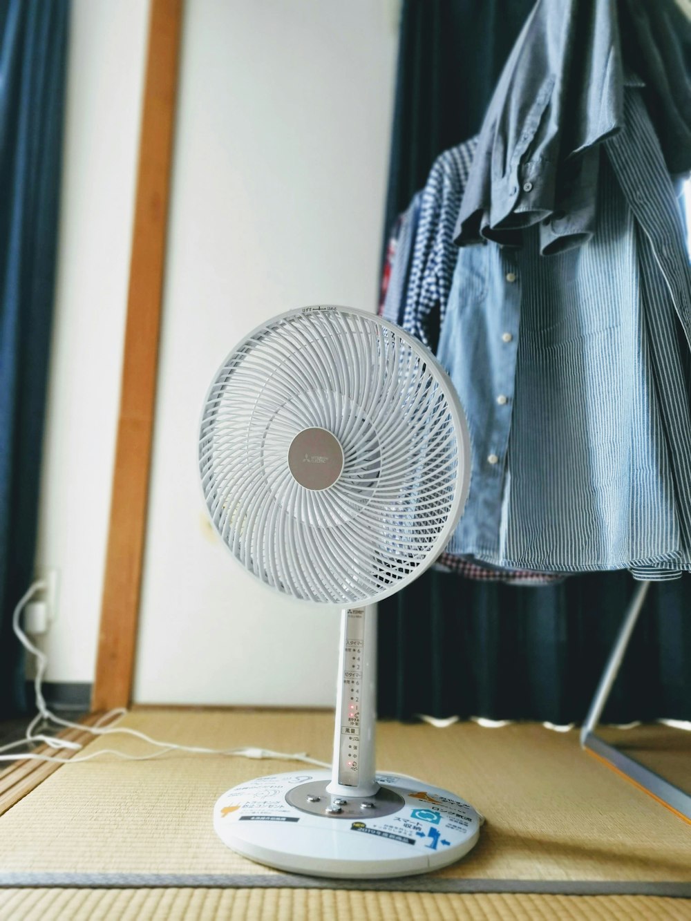 White air circulator fan cooling a home office